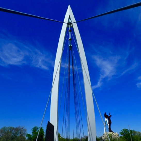 Crossing the pedestrian bridge to the Keeper of the Plains